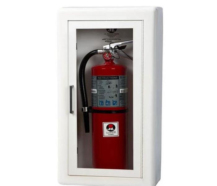 A fire extinguisher in protective glass case