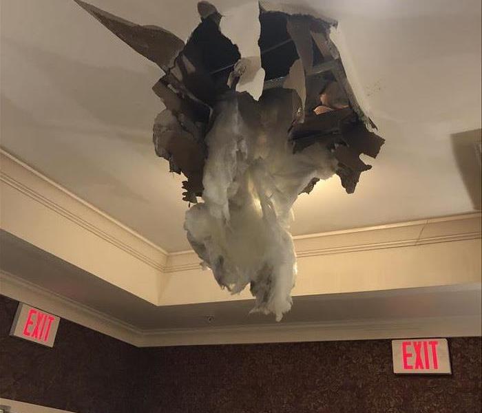 A pipe broke in the ceiling causing drywall to fall down and water leaking out